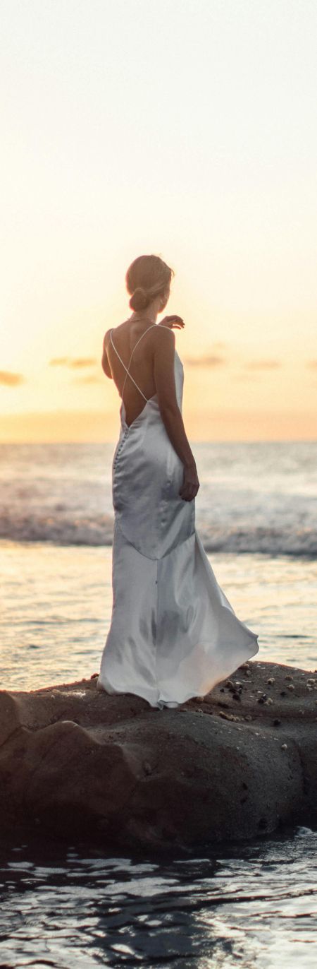 Dedham med spa model in a bridal-type gown at the beach